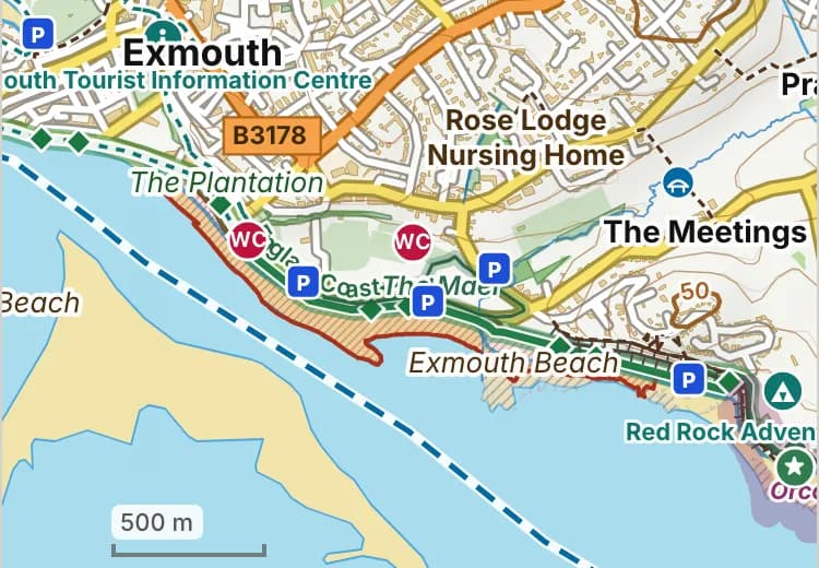 Map of Exmouth beach: the stretch where dogs are banned 1 May to 30 September is hatched in brick, and the esplanade and beach gardens, where dogs must be on a lead all year, has a dashed brick edge.