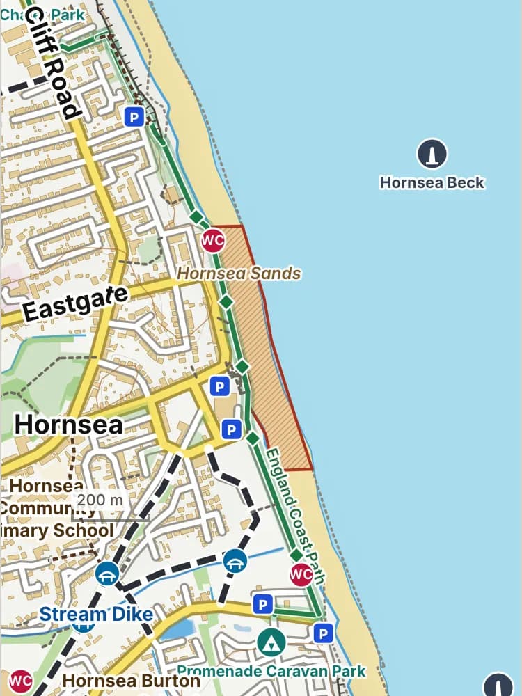 Map of Hornsea beach: the stretch where dogs are banned 1 May to 30 September is hatched in brick. Beaches we have not placed an order on are outlined in grey dots, and say nothing about dogs.