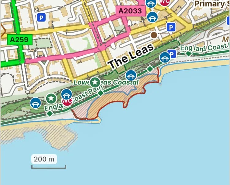Map of Mermaid Beach: the stretch where dogs are banned 1 May to 30 September is hatched in brick, and the promenade by the mermaid café, where dogs must be on a lead 1 May to 30 September, has a dashed brick edge. Beaches we have not placed an order on are outlined in grey dots, and say nothing about dogs.