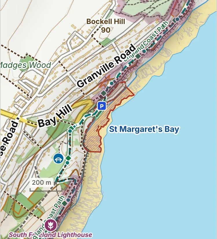 Map of St Margaret’s Bay beach: the stretch where dogs are banned 1 May to 30 September is hatched in brick, and the promenade, car park and grass, where dogs must be on a lead all year, has a dashed brick edge.
